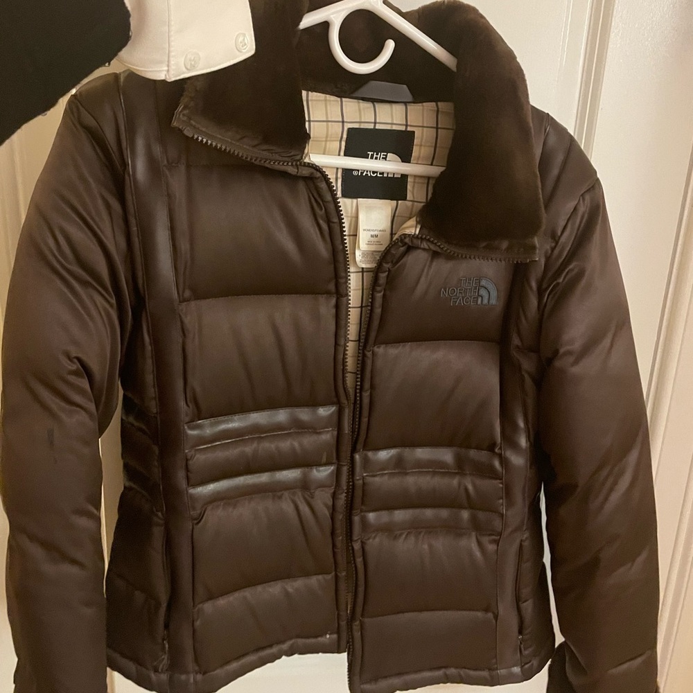 Brown puffer north face with fur on collar and wrists. Good condition